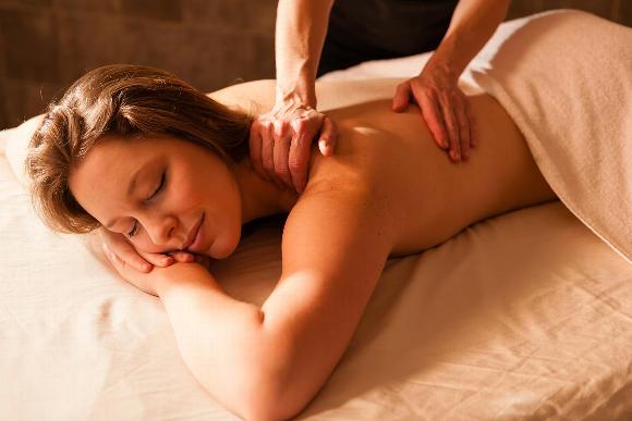 Woman relaxing during back massage